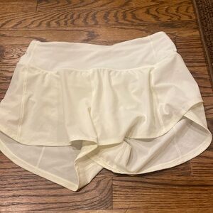 Light green ish yellow Lululemon speed up shorts size 4 4” perfect condition